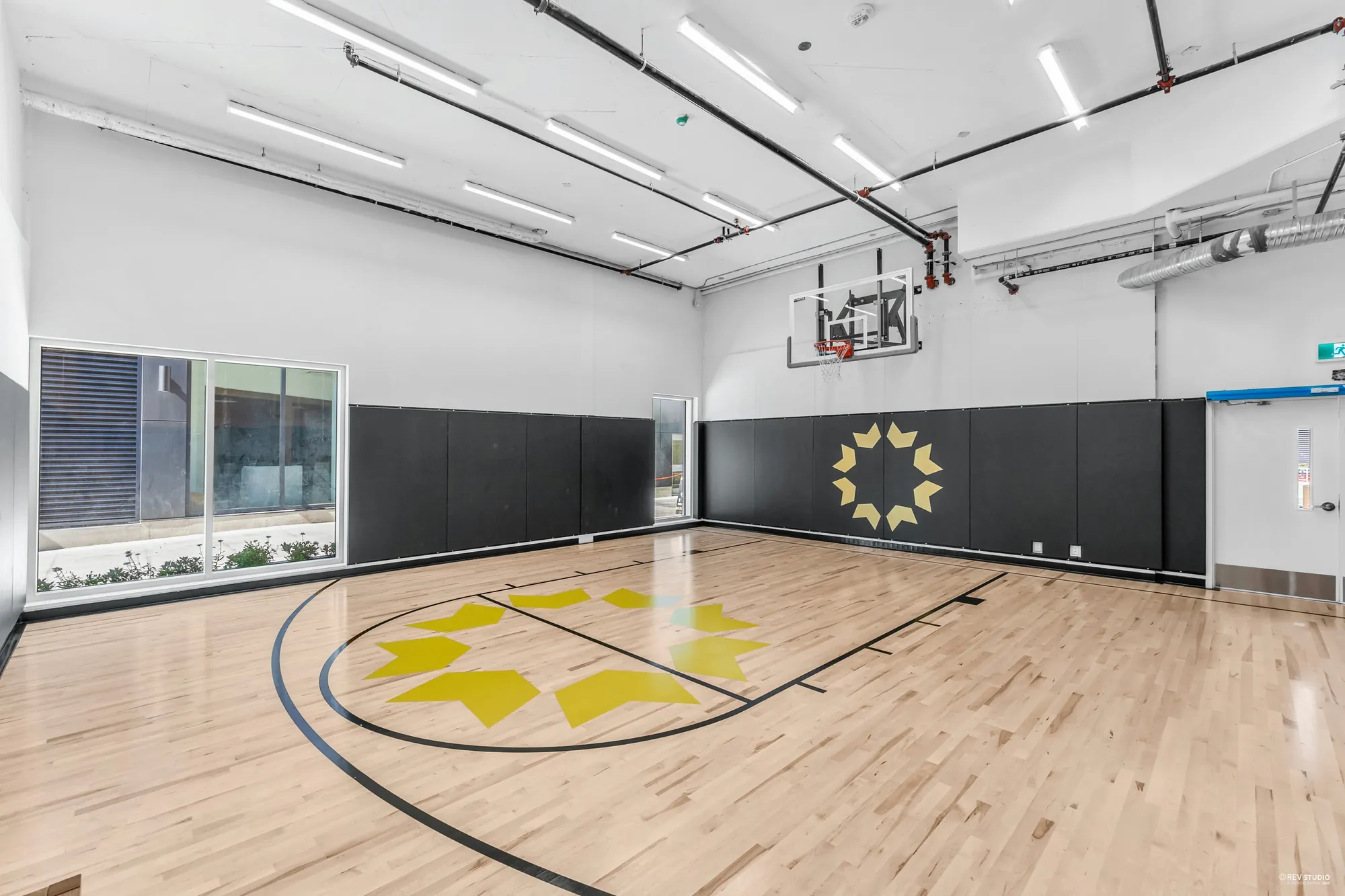Indoor basketball court in the amenity hub