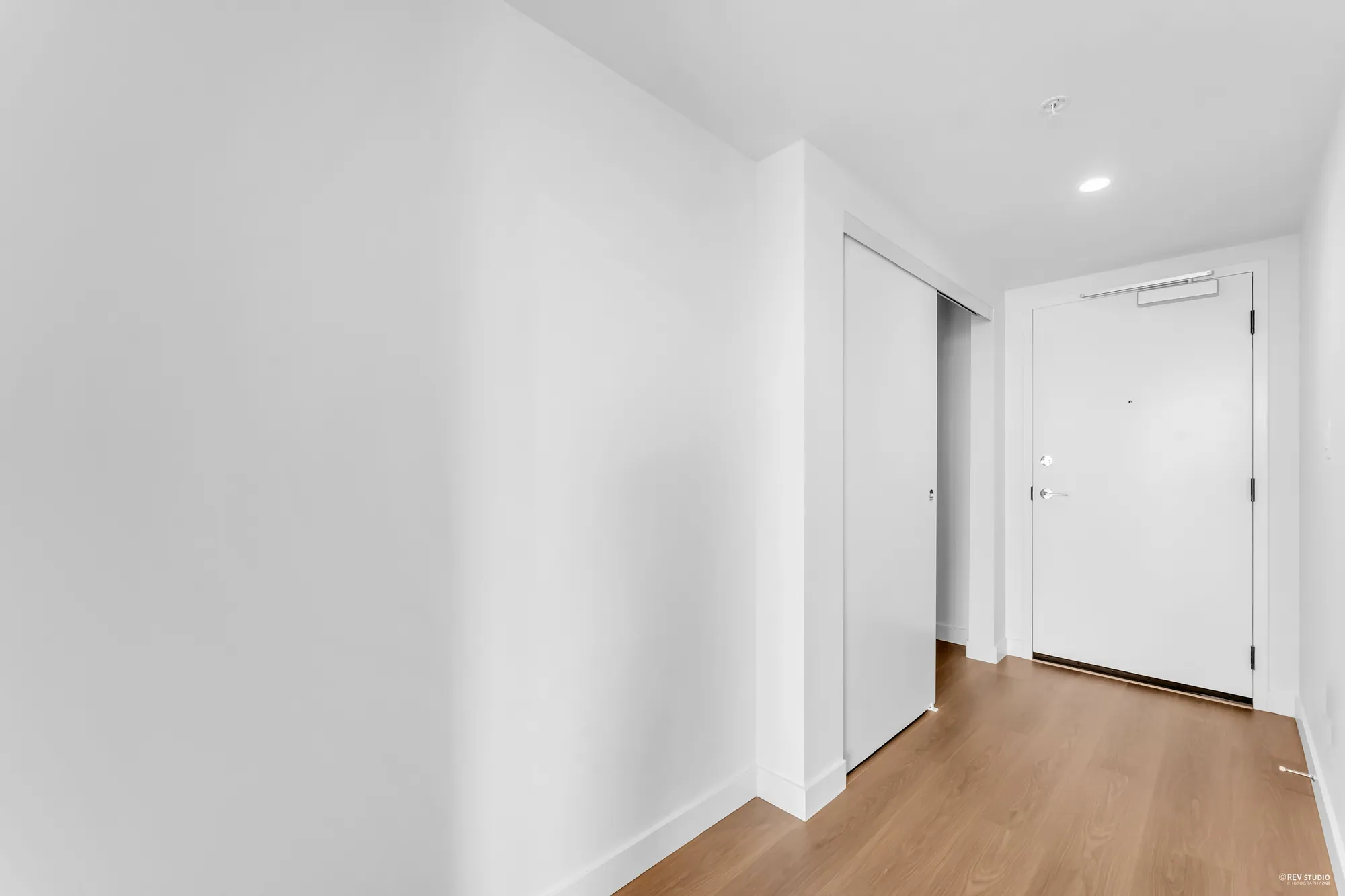 The foyer: front door, closet and the hall in