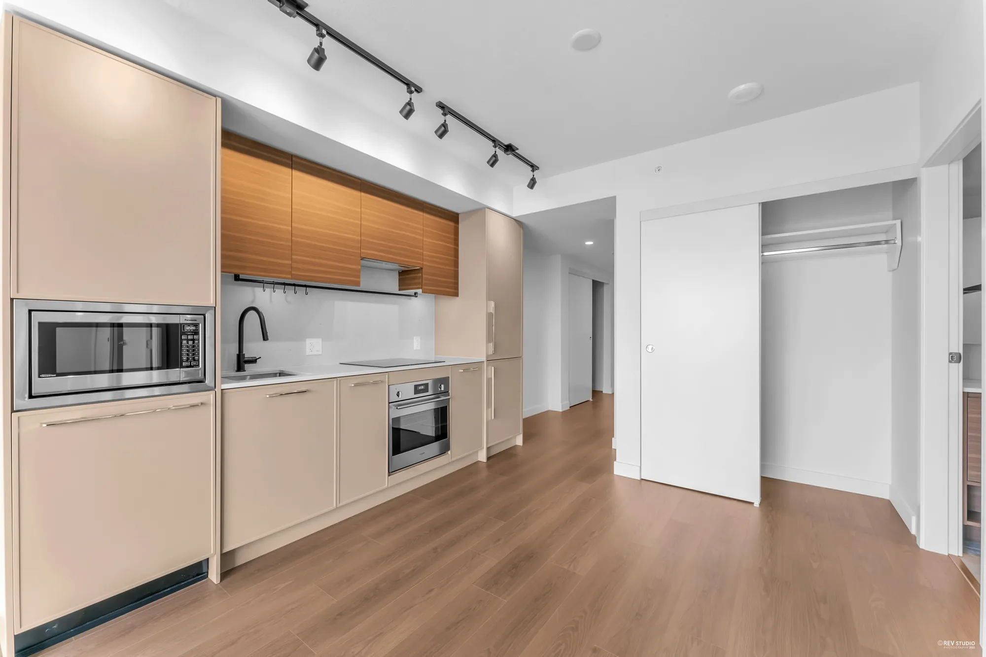 Kitchen from the living room, closet doors on the right