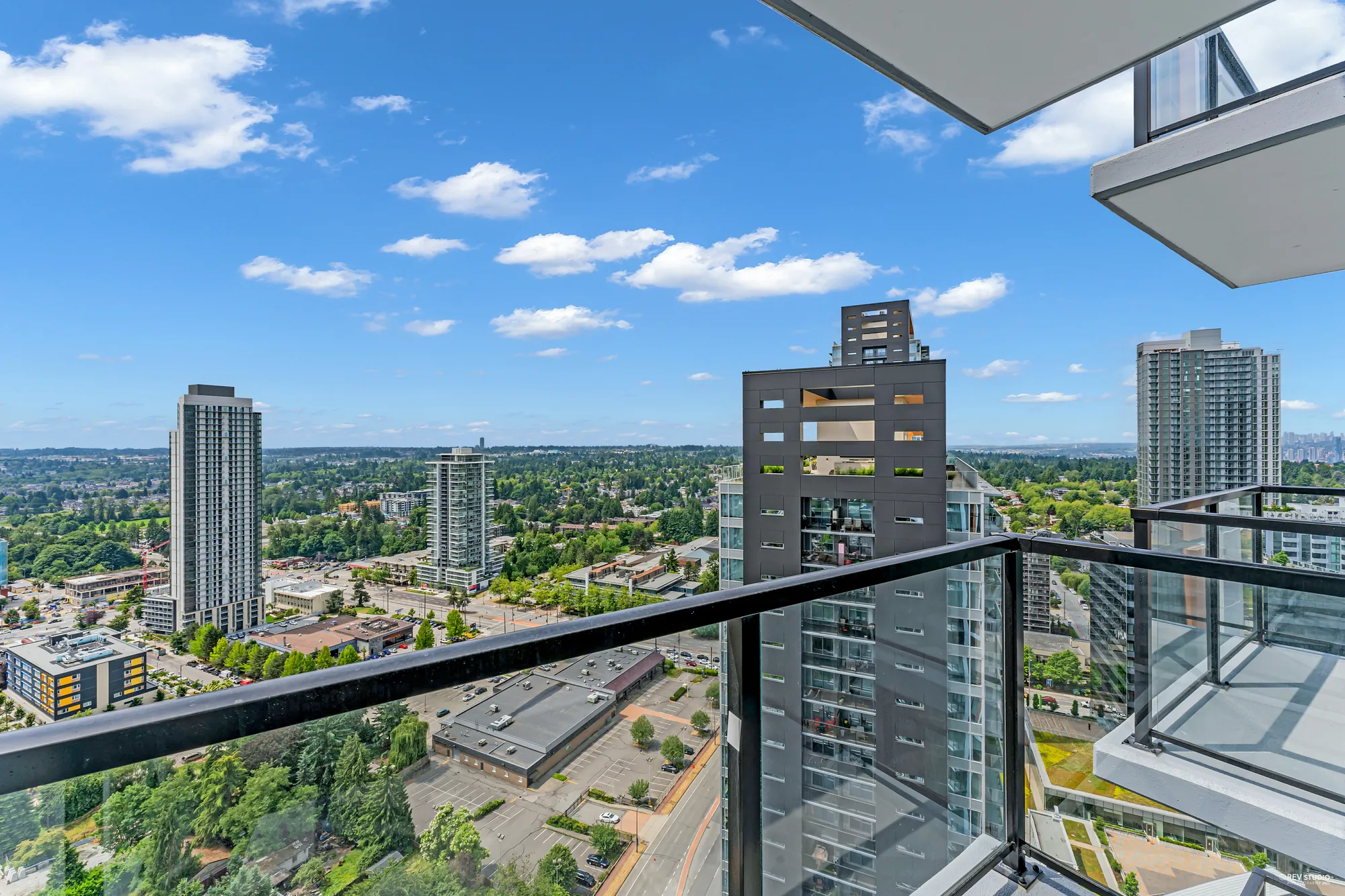From the balcony: towers and tree cover to the south